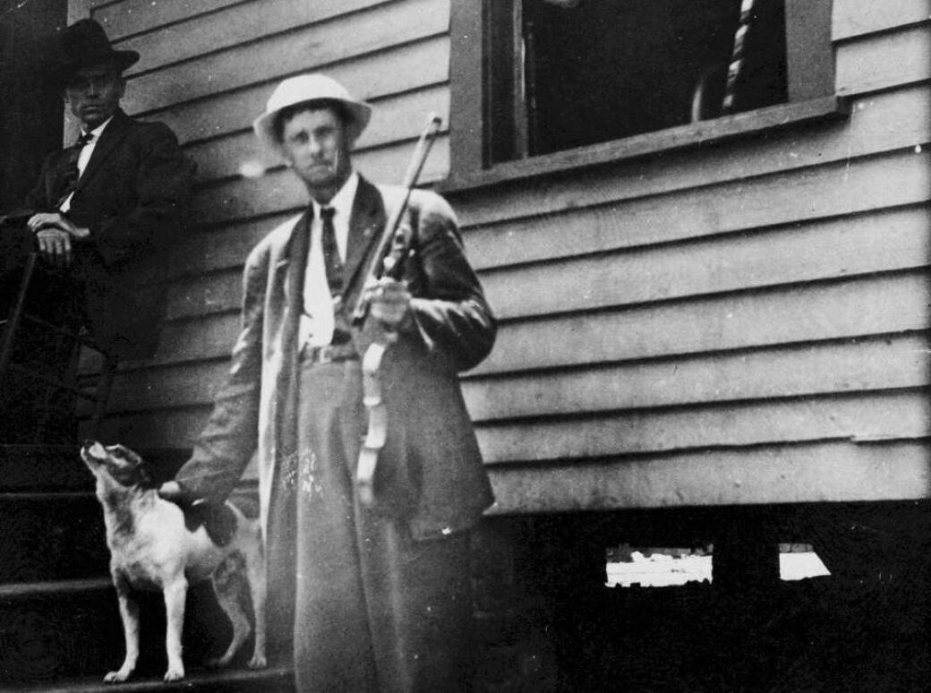 ABOUT TO BE EVICTED: Fiddlin' John Carson stands outside his home in Cabbagetown in 1914 during the Fulton Bag & Cotton Mill Strike.