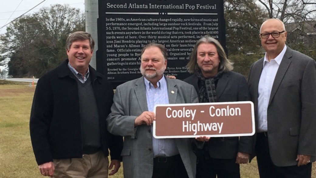 LOST HIGHWAY: Rep. Robert Dickey (from left), State Senator Jeff Mullis, Peter Conlon, and Peach County Chairman Martin Moseley at the Dec. 15 dedication of the Cooley-Conlon Highway.